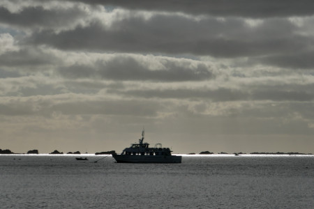 dark clouds and boat